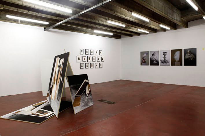 Sabrina Jung, Masken (center) next to works by Anouck Kruithof (left) and Wim Wauman (right), "The staircase knocked the house over", Depot Dam, Antwerpen, Belgien, part of Sugary photographs with tricks, poses and effects – A festival on Photograpyh, 2010© Sabrina Jung